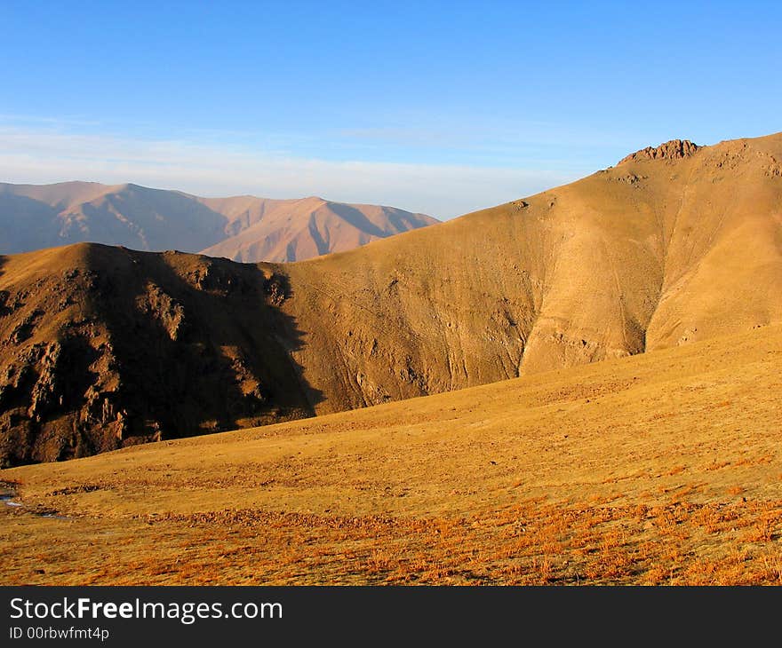 Mountains under sunlight. Babaytag region, Uzbekistan. Mountains under sunlight. Babaytag region, Uzbekistan