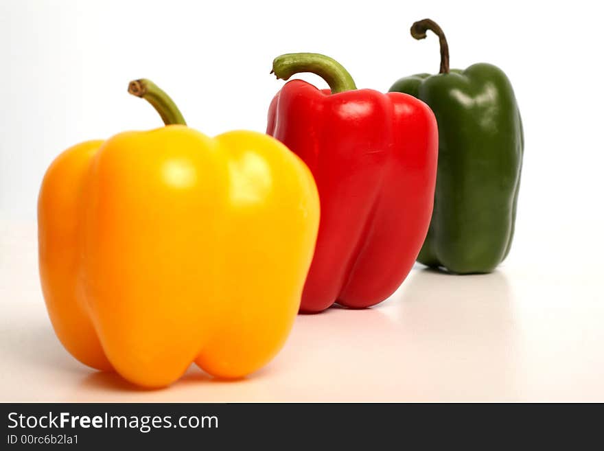 Color peppers in row