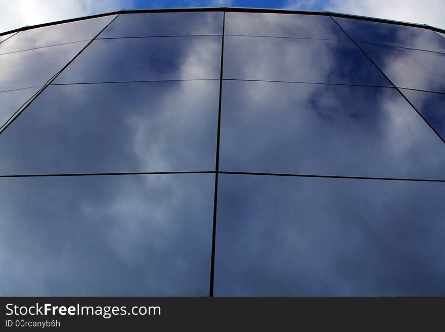 Reflections of the sky and clouds in the glass. Reflections of the sky and clouds in the glass.