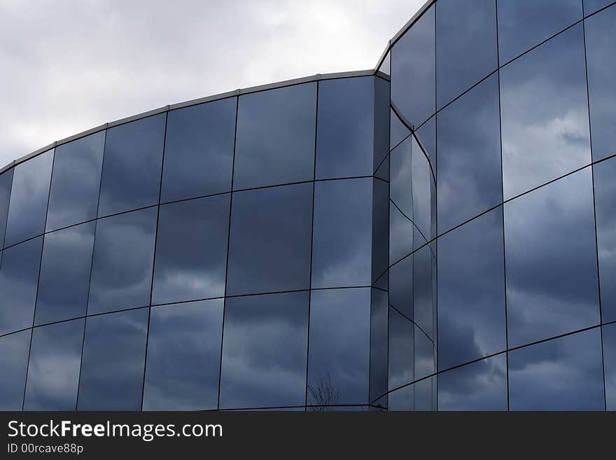 Reflections of the sky and clouds in the glass. Reflections of the sky and clouds in the glass.