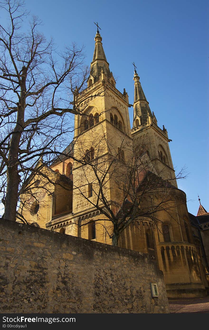 Catholic cathedral in evening light. Vertical. Neuchatel, Switzerland. Catholic cathedral in evening light. Vertical. Neuchatel, Switzerland.