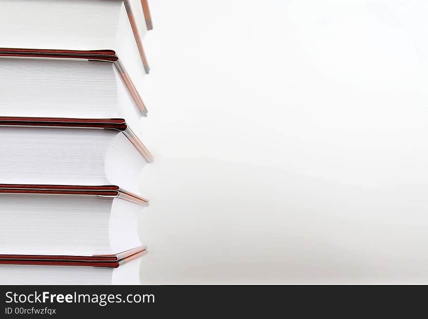 Couple books on left over white background