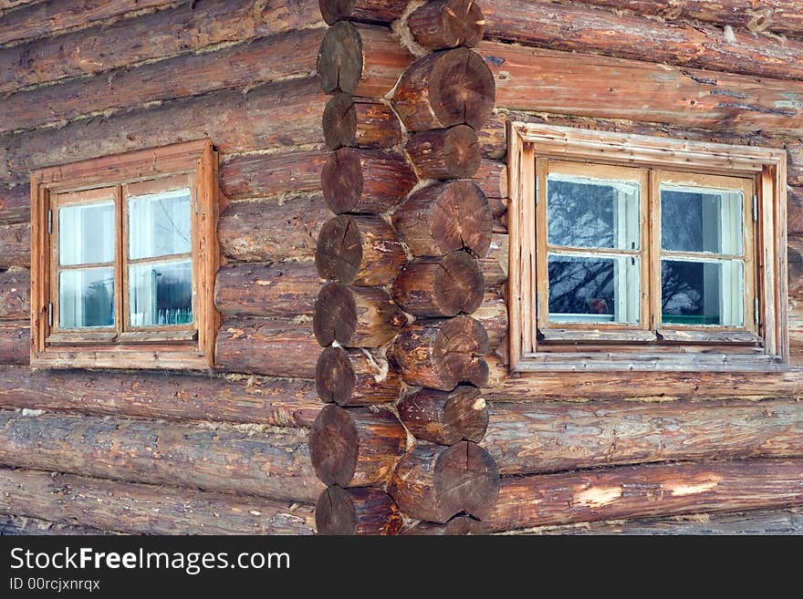 Logs in the wall of old rural house.