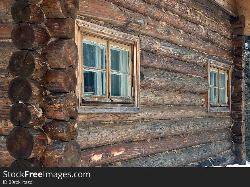 Logs in the wall of old rural house.