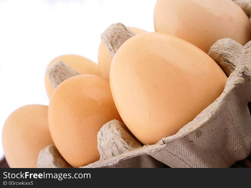 Brown eggs against a bright white background