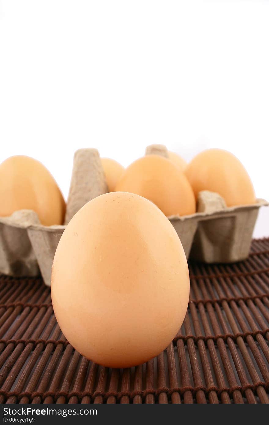 Brown eggs against a bright white background