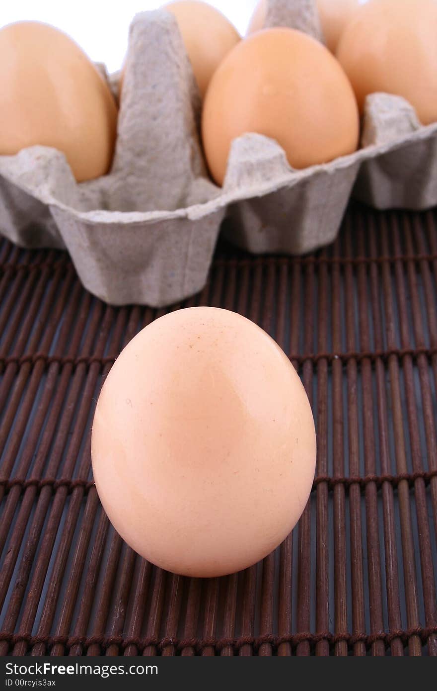 Brown eggs against a bright white background