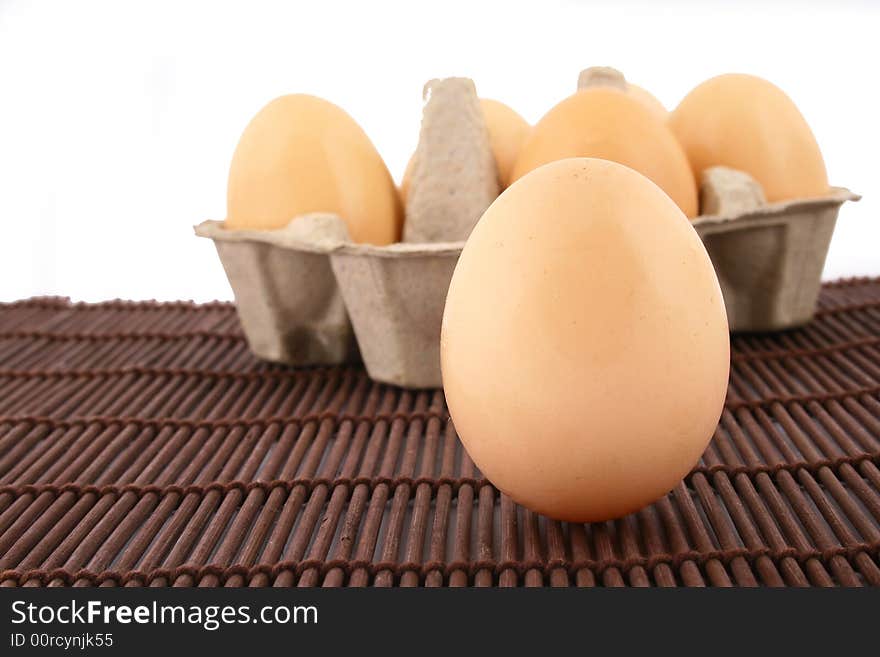 Brown eggs against a bright white background