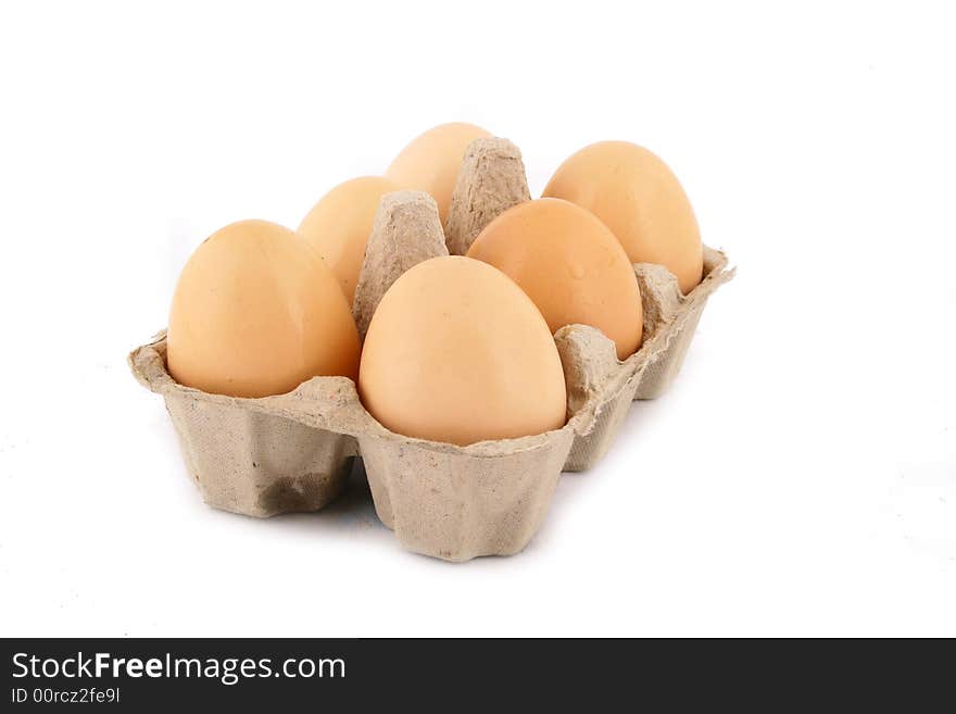 Brown eggs against a bright white background