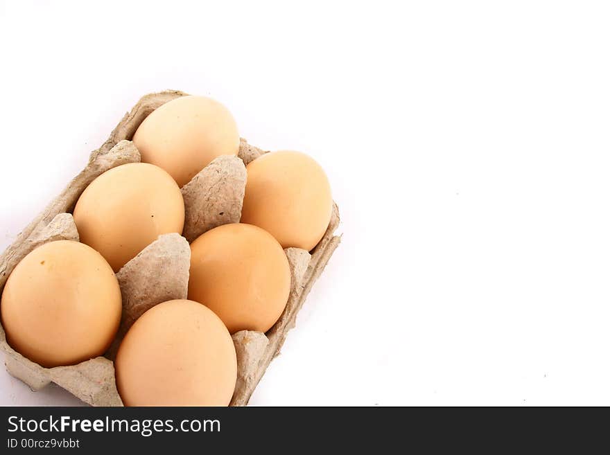 Brown eggs against a bright white background