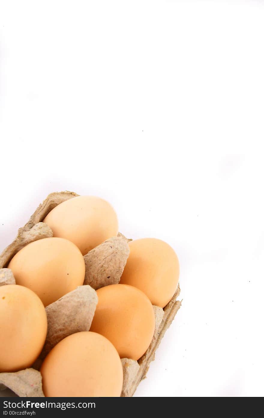 Brown eggs against a bright white background