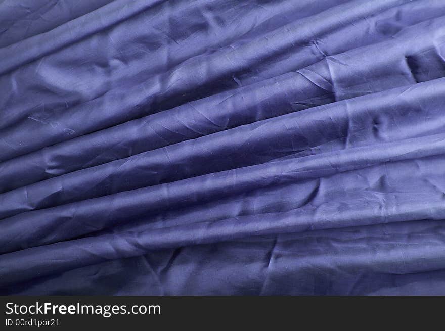 Abstract background blue silk fabric with waves. Abstract background blue silk fabric with waves