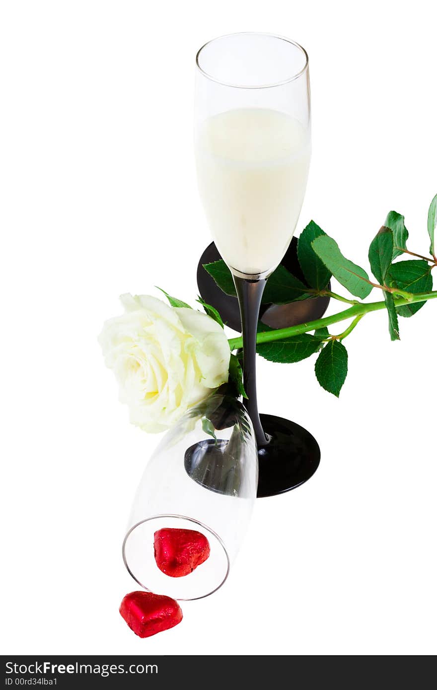 Two glasses with a rose and red hearts (isolated)