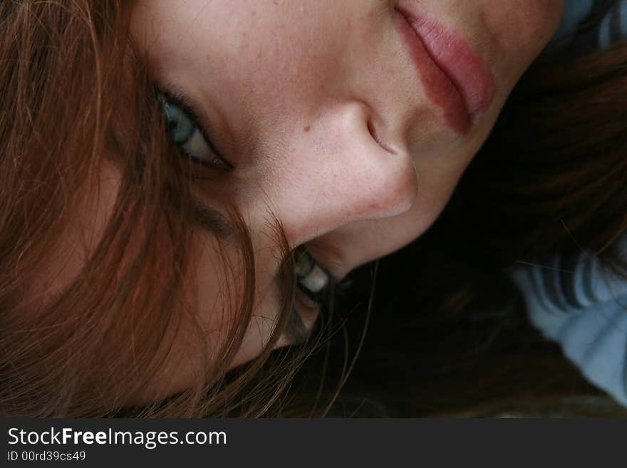 A white caucasian girl looking straight into the camera with one green eye and one blue eye. A white caucasian girl looking straight into the camera with one green eye and one blue eye