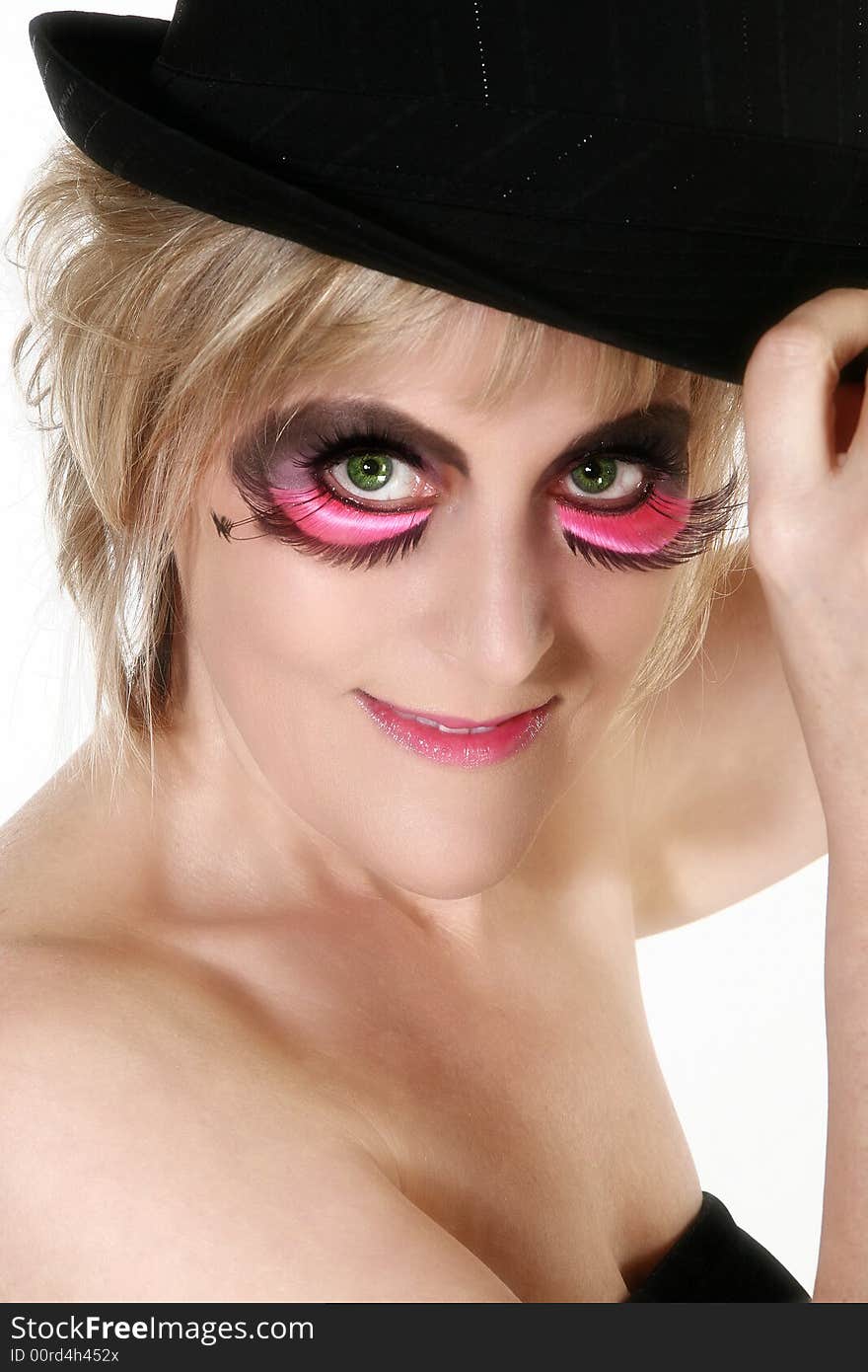 Beautiful 40 year old woman in artistic make-up and hat. Beautiful 40 year old woman in artistic make-up and hat.