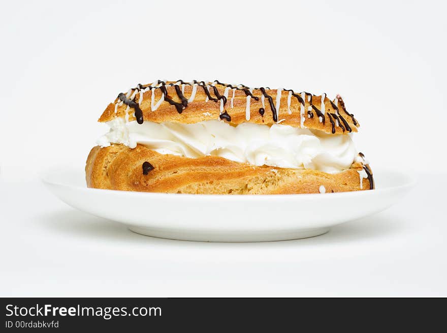 Yummy eclair. Isolated on white.