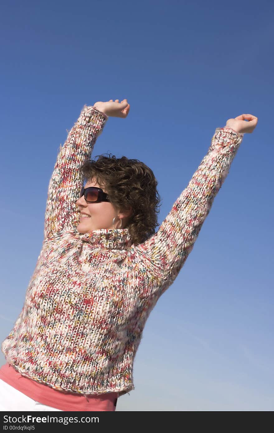 Happy woman relaxing outside, spring is coming