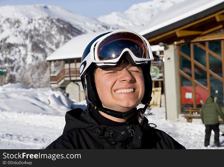 The portrait of happy snowboarder