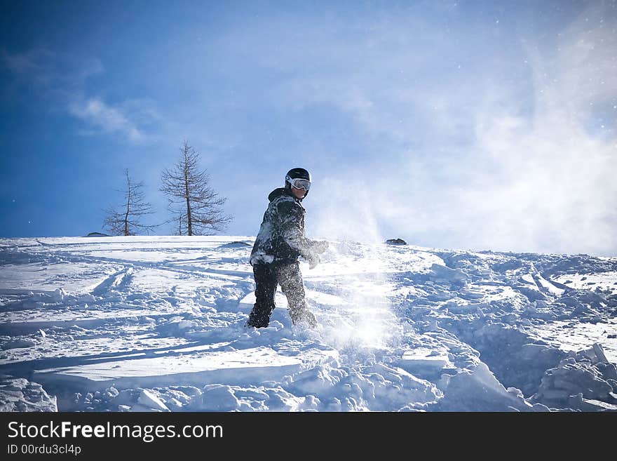 The Snowboarder Riding On A Virgin Soil