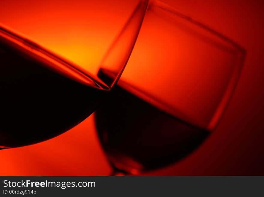 Two glasses on red background