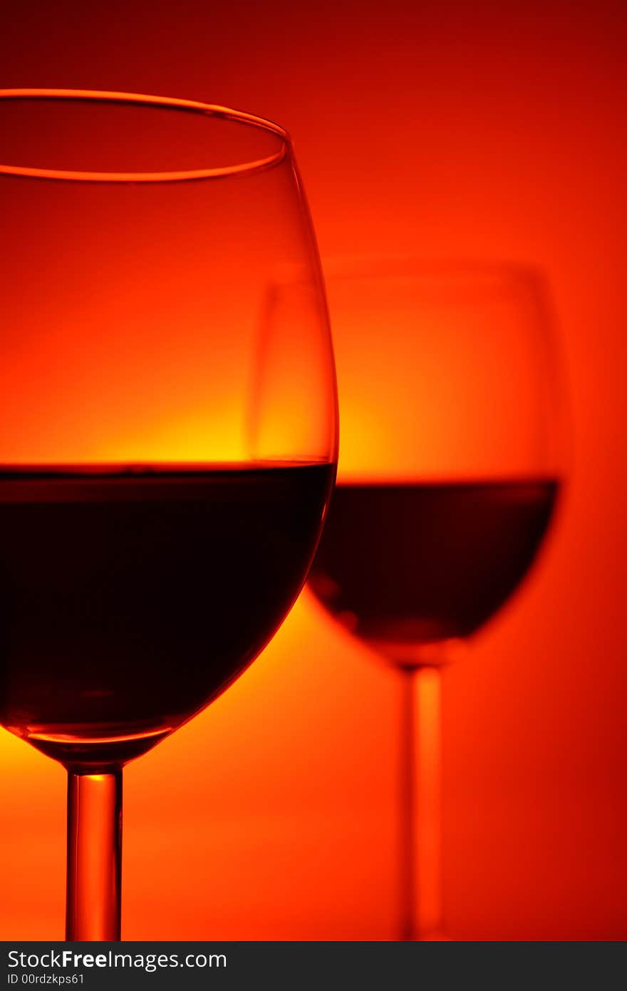 Two glasses on red background