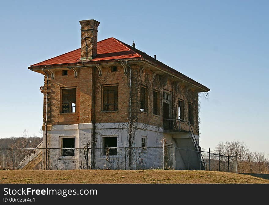 An old abandoned building and blue sky