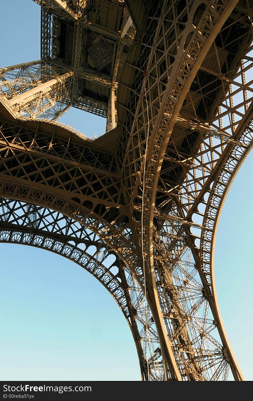 The Eiffel Tower is an iron tower built on the Champ de Mars beside the River Seine in Paris. The tower has become a global icon of France and is one of the most recognizable structures in the world.