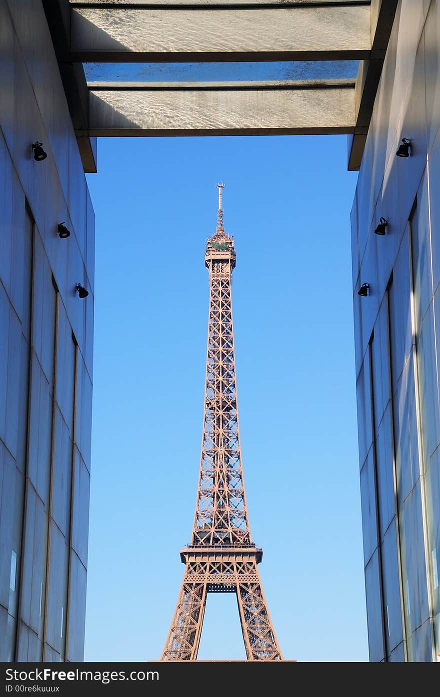 Eiffel tower in Paris, France, Europe. View from Champ de Mars. South and East leg in front. Eiffel tower in Paris, France, Europe. View from Champ de Mars. South and East leg in front.