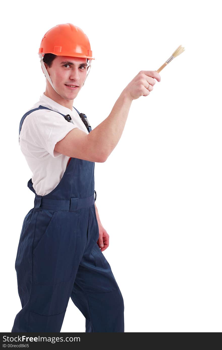 Muscular young man in a builder uniform with tools. Muscular young man in a builder uniform with tools.