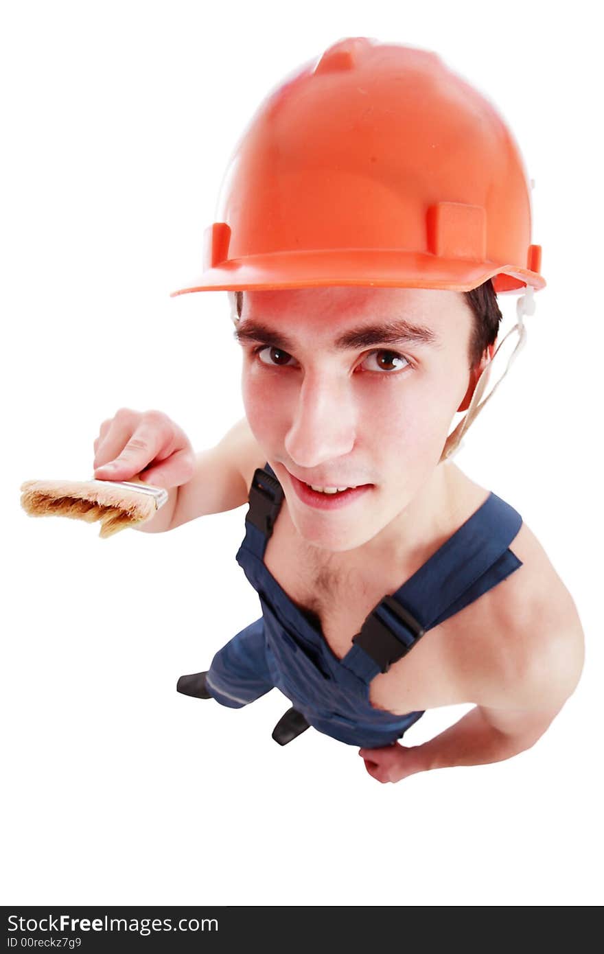 Muscular young man in a builder uniform with tools. Muscular young man in a builder uniform with tools.