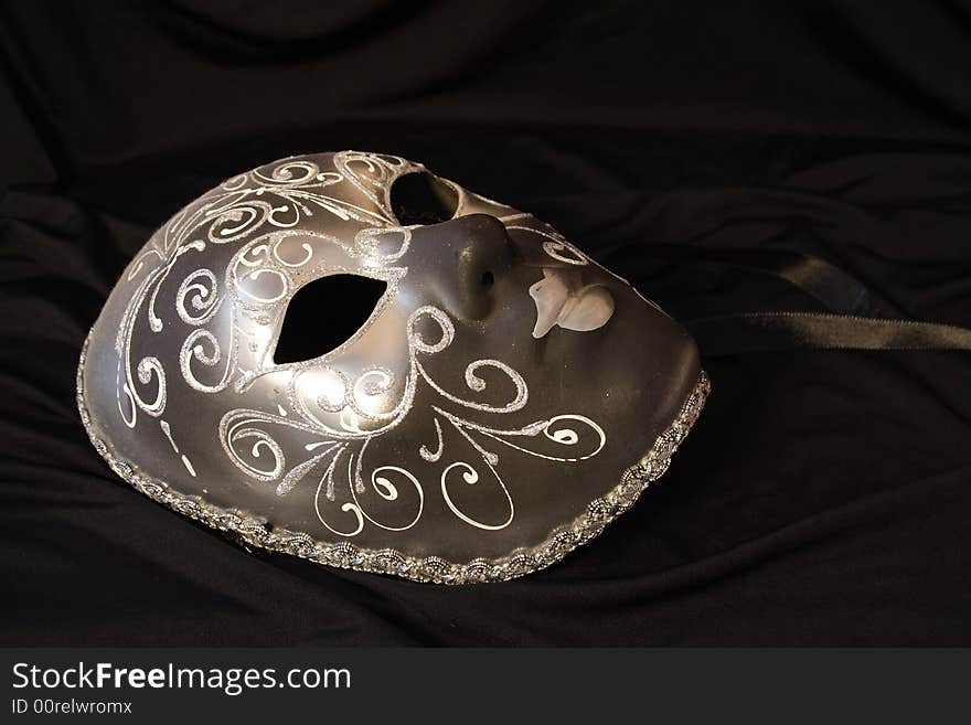 Handmade carnival venetian mask isolated over black background