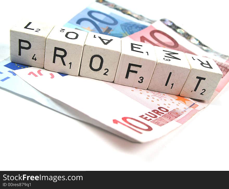 Some Euro banknotes and the word profit