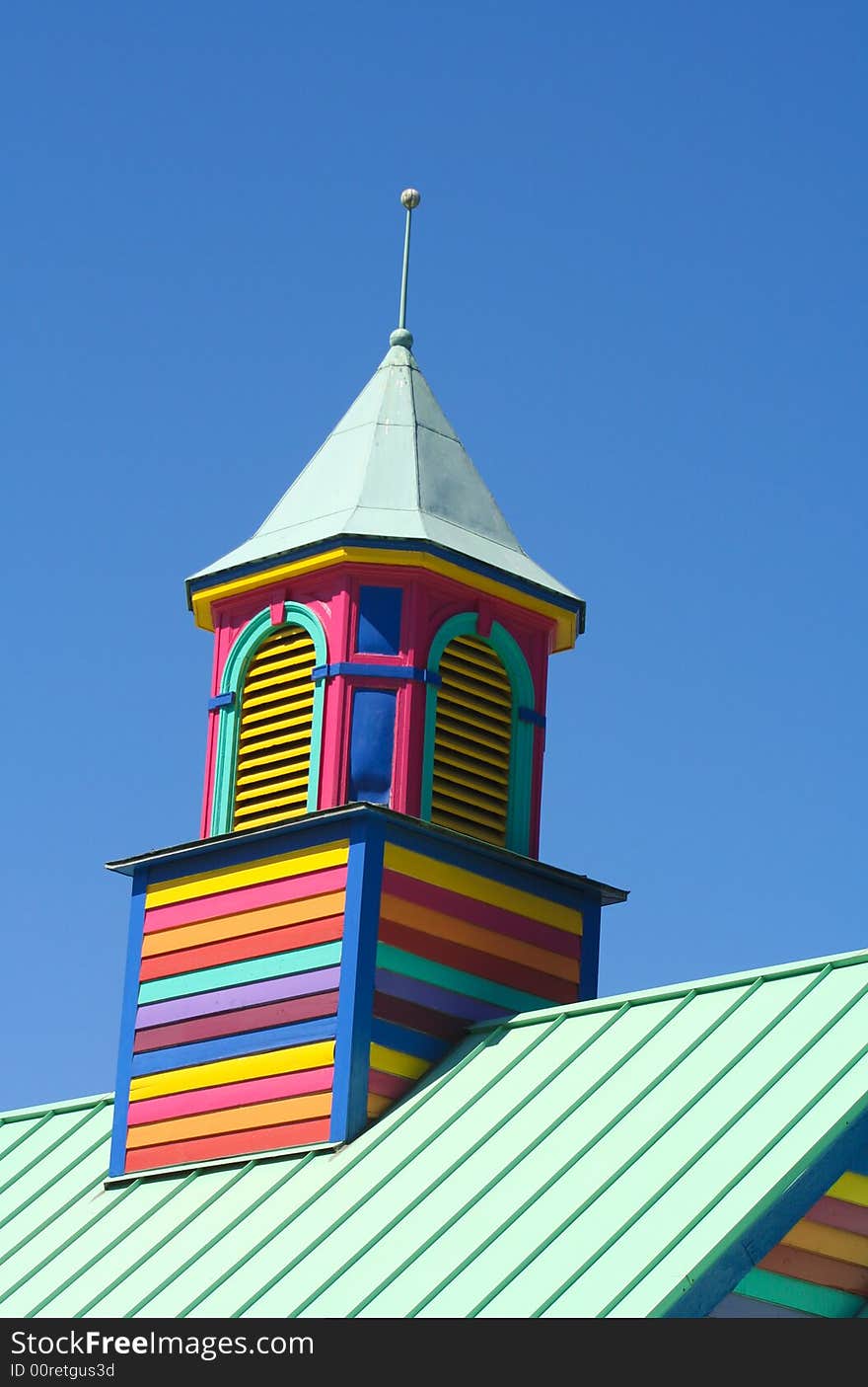 Colorful wooden slatted tower against a blue sky. Colorful wooden slatted tower against a blue sky