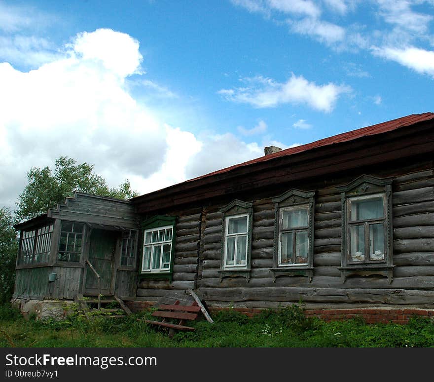 A typical shaky old wooden house in a Russian village. A typical shaky old wooden house in a Russian village.