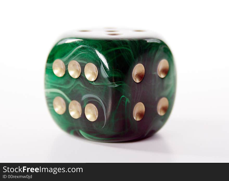 Beautiful green dice with golden dots, for successful gambling.