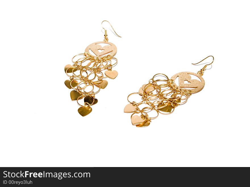 Golden ear-rings on the white isolated background