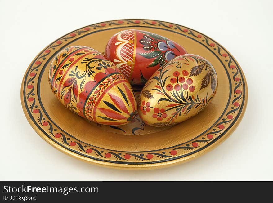 Colour wooden dish with figure. Colour easter eggs.