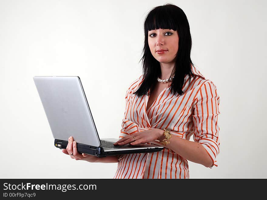 Young beautiful professional women with laptop in the hands