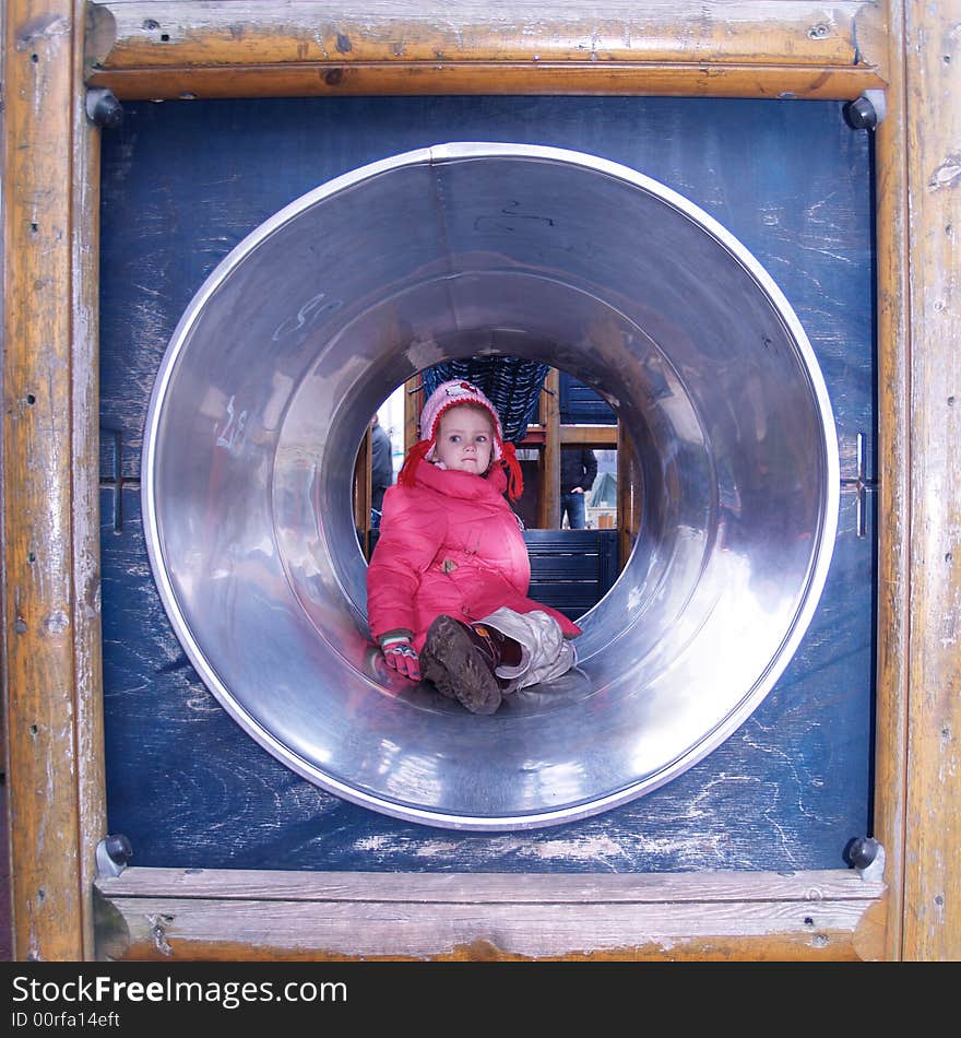 Little girl playing in playground