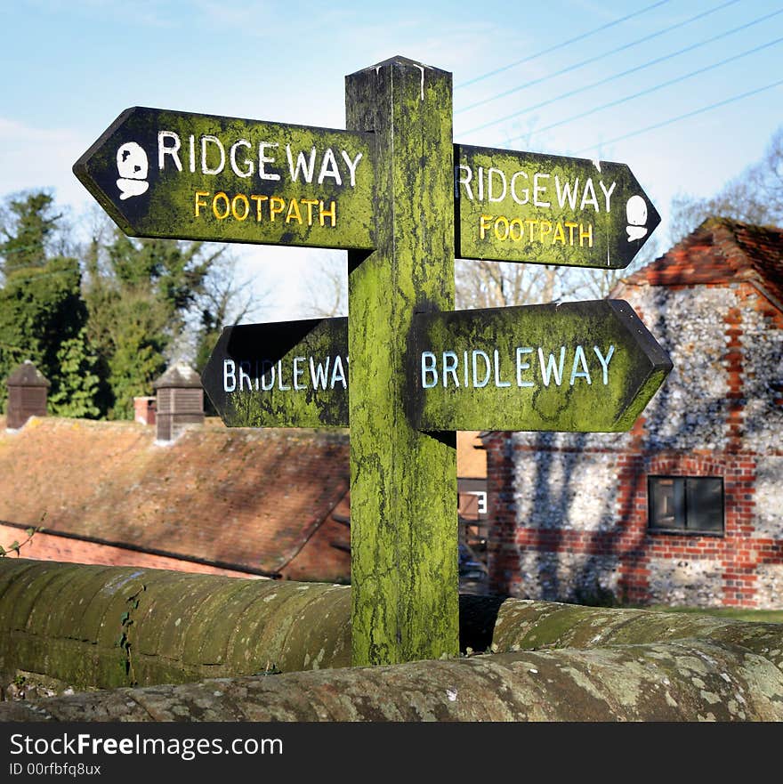 Moss covered Bridleway and Footpath Sign on an English Rural Path. Moss covered Bridleway and Footpath Sign on an English Rural Path