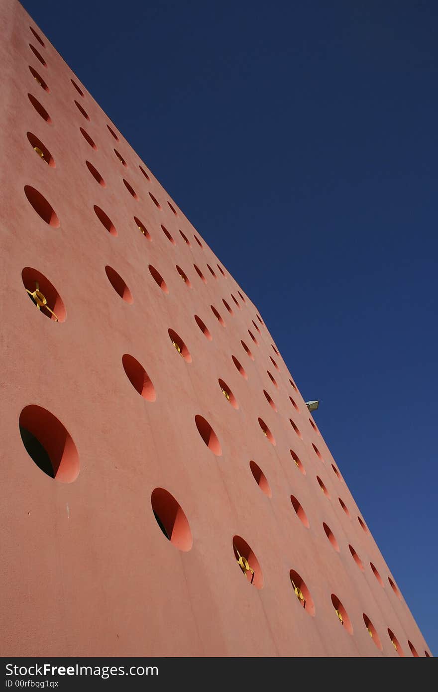 Orange hall whit holes whit blue sky