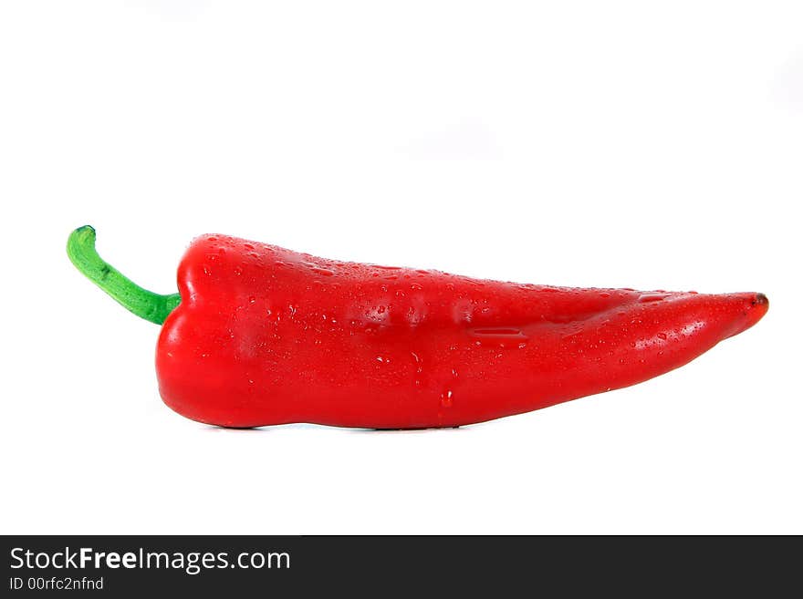 Shot of red pepper with waterdrops on it - over white background. Shot of red pepper with waterdrops on it - over white background.