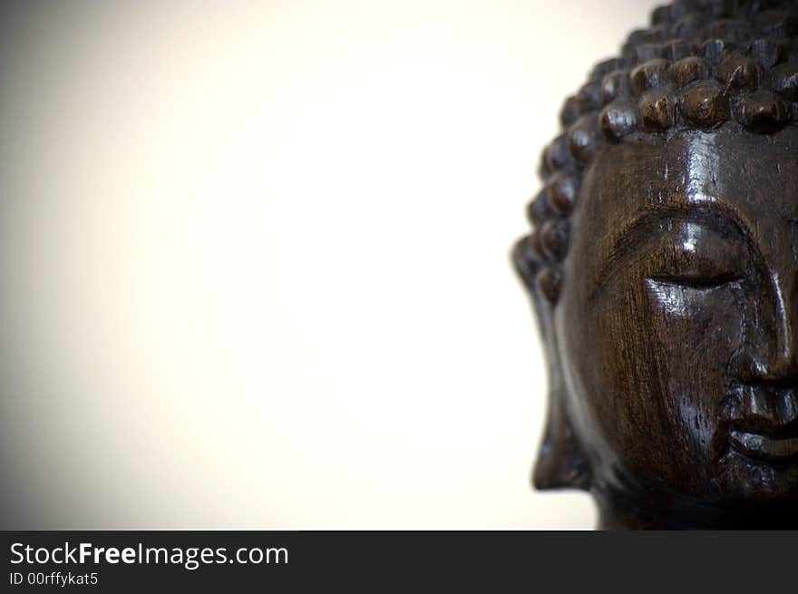 The face of a buddha wood statue