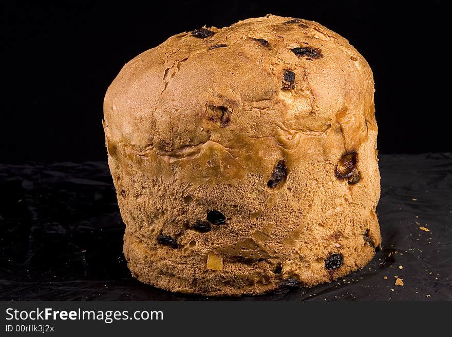 A closeup view of a whole loaf or cake of Panettone, a typical sweet bread of Milan, usually prepared and enjoyed for Christmas and New Year around Italy.