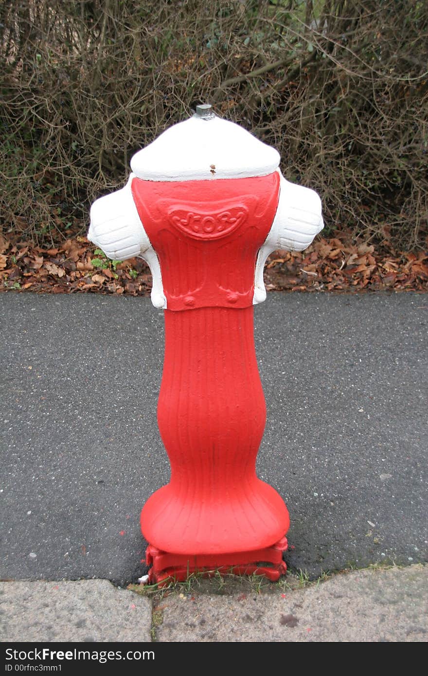 Funny fire hydrant painted red and white. Funny fire hydrant painted red and white