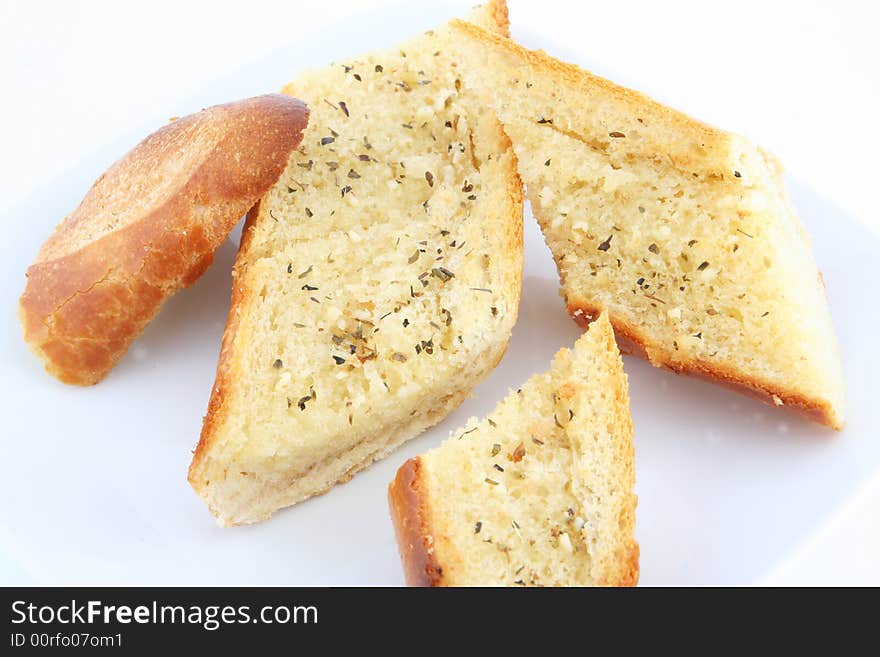 Oven baked garlic bread in plate. Oven baked garlic bread in plate