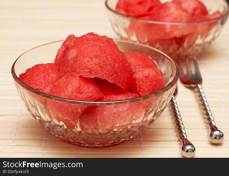 Watermelon scoops in crystal bowls