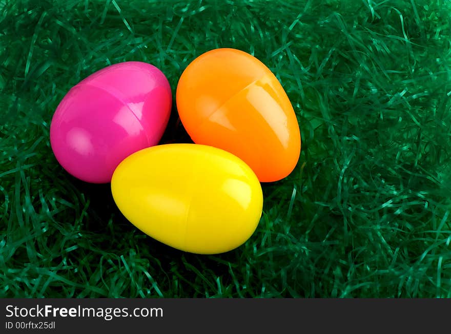 Colorful Easter eggs on green straw