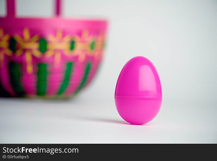 Easter egg and basket on white background