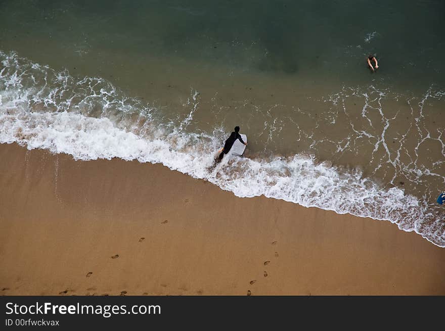 Surfers and swimmers in Kahana beach, Maui, Hawaii. Surfers and swimmers in Kahana beach, Maui, Hawaii.